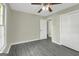 Bedroom with two closets, ceiling fan and view of an additional bedroom at 3180 S Elizabeth Dr, Douglasville, GA 30135
