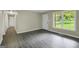 Bedroom with grey floors, neutral walls and plenty of natural light at 3180 S Elizabeth Dr, Douglasville, GA 30135