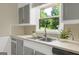 Kitchen features stylish sink, countertops, and a bright window view at 3180 S Elizabeth Dr, Douglasville, GA 30135