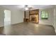 Bright living room featuring a brick fireplace, built-in shelving, and modern ceiling fan at 3180 S Elizabeth Dr, Douglasville, GA 30135