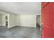 Spacious living room with gray floors and fresh, neutral paint at 3180 S Elizabeth Dr, Douglasville, GA 30135