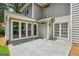 Backyard view featuring patio and the home's exterior with multiple windows and a door at 3506 Billingsley Dr, Marietta, GA 30062