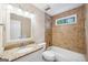 Bathroom with granite countertops, a tub with tiled surround, and ample lighting at 3506 Billingsley Dr, Marietta, GA 30062