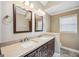 Bathroom featuring double vanity with granite counters and dark wood cabinets at 3506 Billingsley Dr, Marietta, GA 30062