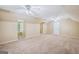 Large bonus room featuring carpet, ceiling fans, and natural light from multiple windows at 3506 Billingsley Dr, Marietta, GA 30062