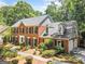 Traditional brick home with a well-maintained yard, charming shutters, and a three-car garage at 3506 Billingsley Dr, Marietta, GA 30062