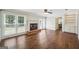 Spacious living room with hardwood floors, fireplace and an adjacent built-in bookshelf at 3506 Billingsley Dr, Marietta, GA 30062