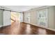 Spacious living room with hardwood floors and sliding barn doors leading to entryway at 3506 Billingsley Dr, Marietta, GA 30062