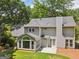 Back of home featuring a well-kept lawn, sun room and patio at 3506 Billingsley Dr, Marietta, GA 30062