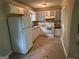 Efficient kitchen features white appliances, ample cabinet space, and a functional layout at 718 Hardy Way, Hiram, GA 30141