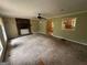Inviting living room featuring a cozy brick fireplace and a ceiling fan for added comfort at 718 Hardy Way, Hiram, GA 30141