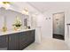 Modern bathroom features a double vanity with black cabinets and a tiled shower with a glass door at 1836 Memorial Dr # 303, Atlanta, GA 30317