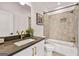 Bathroom with white vanity and shower/tub combination with modern tile and gold fixtures at 1836 Memorial Dr # 303, Atlanta, GA 30317