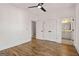 Bedroom with hardwood floors, a ceiling fan, and an ensuite bathroom at 1836 Memorial Dr # 303, Atlanta, GA 30317