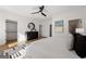 Bedroom with a ceiling fan, hardwood floors, black dresser and an open closet at 1836 Memorial Dr # 303, Atlanta, GA 30317