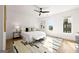 Bright bedroom with a ceiling fan, hardwood floors, and a modern rug at 1836 Memorial Dr # 303, Atlanta, GA 30317