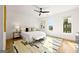 Primary bedroom featuring a ceiling fan, neutral decor, and hardwood floors at 1836 Memorial Dr # 303, Atlanta, GA 30317