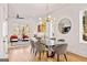 Open concept dining room featuring modern lighting, wood floors, and views of the living room at 1836 Memorial Dr # 303, Atlanta, GA 30317