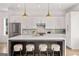 Bright kitchen with stainless steel appliances, island seating and white cabinets at 1836 Memorial Dr # 303, Atlanta, GA 30317