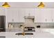 Contemporary kitchen featuring white cabinets, stainless steel appliances, and a white countertop island at 1836 Memorial Dr # 303, Atlanta, GA 30317