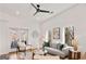 Bright living room with a ceiling fan, hardwood floors, and a balcony at 1836 Memorial Dr # 303, Atlanta, GA 30317
