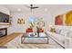 Open living room area featuring hardwood floors, modern lighting, and a marble fireplace at 1836 Memorial Dr # 303, Atlanta, GA 30317