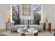 Bright living room featuring a comfortable sofa, stylish decor, and views to the outdoors at 1836 Memorial Dr # 303, Atlanta, GA 30317