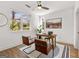 Bright home office with modern fan, stylish desk and chairs, and large window at 1836 Memorial Dr # 303, Atlanta, GA 30317