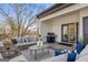 Inviting covered deck with a seating area, grill, and serene views at 1836 Memorial Dr # 303, Atlanta, GA 30317