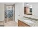 Bathroom featuring a glass enclosed shower, vanity with a granite countertop and white cabinets at 79 The Farm Rd, Mcdonough, GA 30252