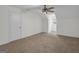 Bright bedroom featuring neutral carpet, a ceiling fan, and a window for natural light at 79 The Farm Rd, Mcdonough, GA 30252