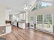 Open concept kitchen featuring white cabinets, updated appliances, and a large window for natural light at 79 The Farm Rd, Mcdonough, GA 30252