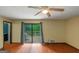 Bright bedroom with sliding glass doors to a private balcony, ceiling fan and neutral walls at 959 Sweet Briar Se Trl, Conyers, GA 30094