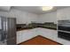 Well-lit kitchen with white cabinets, butcher block countertops, stainless steel appliances, and mosaic tile backsplash at 959 Sweet Briar Se Trl, Conyers, GA 30094