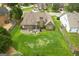 Aerial view showing the house, large backyard, patio area, and surrounding neighborhood at 1511 Rocky Knoll Ln, Dacula, GA 30019