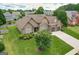 Aerial view of a landscaped home in a neighborhood with mature trees and green lawns at 1511 Rocky Knoll Ln, Dacula, GA 30019