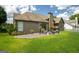 Backyard view of home with large yard, patio, and outdoor furniture at 1511 Rocky Knoll Ln, Dacula, GA 30019