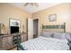 Bedroom with hardwood flooring, ceiling fan, queen sized bed and furniture at 1511 Rocky Knoll Ln, Dacula, GA 30019