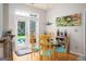 Cozy breakfast nook with a glass table, colorful chairs, and access to the backyard at 1511 Rocky Knoll Ln, Dacula, GA 30019