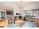 Spacious living room with comfortable seating, a large area rug, and views into the kitchen at 1511 Rocky Knoll Ln, Dacula, GA 30019