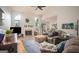 Comfortable living room featuring a fireplace, vaulted ceiling, and ample natural light at 1511 Rocky Knoll Ln, Dacula, GA 30019