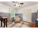 Spacious Bedroom with crib, gray paneled walls, and hardwood flooring at 2163 Medfield Ne Trl, Chamblee, GA 30345