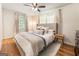 Inviting bedroom featuring a plush bed, neutral decor, and a ceiling fan at 2163 Medfield Ne Trl, Chamblee, GA 30345