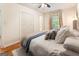 Comfortable bedroom with hardwood floors, large windows, and a closet at 2163 Medfield Ne Trl, Chamblee, GA 30345