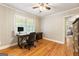 Inviting bedroom with hardwood floors, a desk, and a window, ideal for a workspace at 2163 Medfield Ne Trl, Chamblee, GA 30345