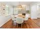 Elegant dining area featuring a round table, comfortable seating, and a stylish wet bar at 2163 Medfield Ne Trl, Chamblee, GA 30345
