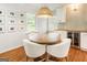 Cozy dining area featuring a round table with white chairs, beverage cooler and pendant lighting at 2163 Medfield Ne Trl, Chamblee, GA 30345
