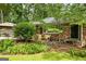 Inviting brick home with well-maintained landscaping and mature trees providing shade at 2163 Medfield Ne Trl, Chamblee, GA 30345