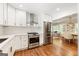 Bright kitchen with stainless steel appliances opens up to the dining and living areas at 2163 Medfield Ne Trl, Chamblee, GA 30345