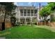 Lush backyard with a sprawling lawn and an elevated screened porch that creates an ideal outdoor retreat at 785 Wilson Nw Rd, Atlanta, GA 30318